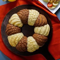 an assortment of pastries are arranged on a plate