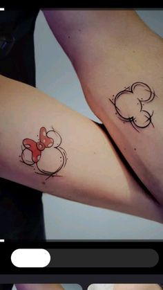 two tattoos on the arms of people with mickey mouse and minnie mouse ears tattooed on them