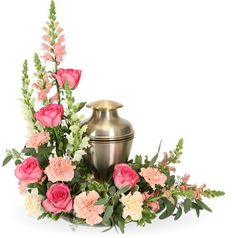 a vase with flowers and greenery on a white background