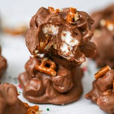 chocolate covered pretzels with marshmallows and candies in the middle