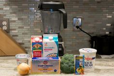 ingredients to make a smoothie sitting on a counter top next to a blender