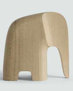 an elephant shaped wooden toy sitting on top of a table