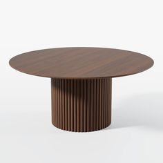 a round wooden table with pleated design on the top and bottom, in front of a white background