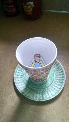 a cup and saucer sitting on top of a table