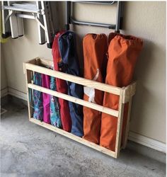 a rack with umbrellas hanging on the wall