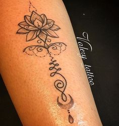 a woman's leg with a tattoo on it that says hope and a flower