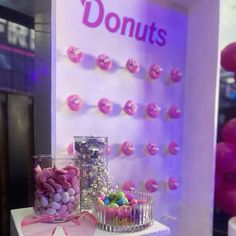 there are candy and candies on display in this storefront window displays donuts