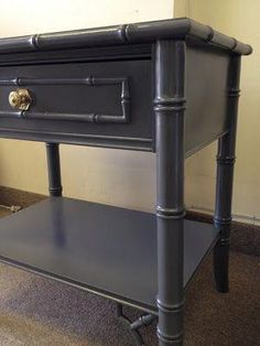 a black table with two drawers on it