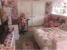 a bedroom decorated in pink and white with hello kitty decorations