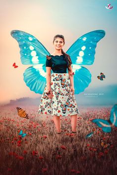 a woman standing in a field with butterflies on her wings