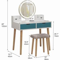 a blue and white desk with a mirror, stool and storage bins on it