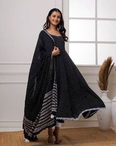 A simple yet alluring Black Mul Mul Polka Dot Anarkali Suit with Solid White Pants and a Dupatta is best for any occasion. The set comes with polka dot anarkali kurta has calf length, sleeveless and round neck teamed with white fully elasticated cotton pants and a mul mul dupatta with lace and tassels in the corner. No of Sets - 3 Color - Black Kurta Fabric – Mul Mul Work – Polka Dot. Sleeves-Sleeveless Slits - No Slits Length - Calf Length Bottom Fabric - Cotton with fully elasticated waistband Dupatta – Mul mul dupatta with lace & tassels detailing CARE: Gentle Hand Wash DISCLAIMER - The color of the product may be differ due to screen settings of device. Black Kurta, Formal Jewelry, Anarkali Kurta, Anarkali Suit, Churidar, White Pants, Fabric Shop, Cotton Pants, Formal Wedding