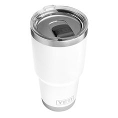 the yeti coffee cup is white and has a metal lid