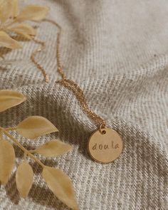 We handcrafted this piece to celebrate birth workers and start conversations about the incredible value of a doula. This simple but beautiful design is the perfect gift, whether you are celebrating your own calling as a doula, or looking to give back to a doula who supported you. Custom hand stamped necklaces, like baby names, etc. are also available upon request. Please reach out with inquiries! Stamped Necklaces, Hand Stamped Necklace, Give Back, Design Simple, Gold Style, Baby Names, Hand Stamped, Beautiful Design, Necklace Etsy