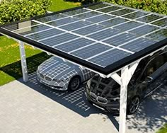 two cars are parked under a solar panel