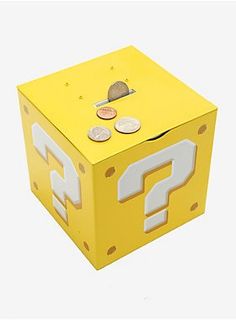 a yellow box with question marks on the front and two coins in the middle, sitting next to each other