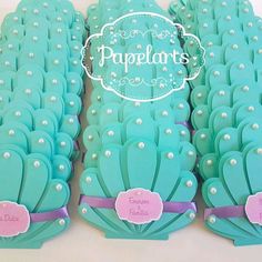 there are many cakes made to look like mermaids with pearls on the top and sides