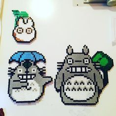 some pixelated images of totoro and hippo on a white table top