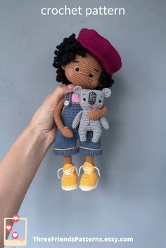 a hand holding a small stuffed animal in front of a wall with the words crochet pattern on it