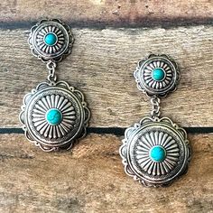 "Western Style Silver Concho Earrings with Turquoise Accents on a post style back. Earrings measure 2\". Matching bracelet sold separately." Turquoise Concho Dangle Jewelry, Adjustable Turquoise Concho Earrings, Tooled Leather Phone Case, Concho Earrings, Turquoise Accents, Matching Bracelet, Leather Phone Case, Matching Bracelets, Leather Tooling