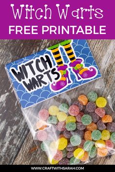 a bag of witch wars candy on top of a wooden table with the text, free print