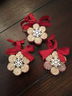 three red bows with snowflakes on them