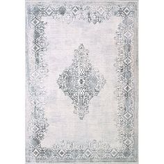 a white rug with an ornate design on the front and back side, in grey tones