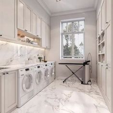 a laundry room with washer and dryer in it