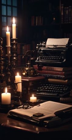 an old fashioned typewriter sitting on top of a table next to candles and books