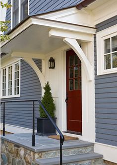 a house with blue siding and white trim