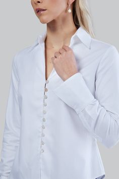 This style is our Best seller and Farinaz first style for this collection! you will be desired in this shapely and stylish tailored women’s shirt. Made from 100% Italian mercerized cotton with a small herringbone pattern. Desire features smart shell brushed buttons with soft loop detail that adds a feminine flair to this cool and classic shirt. This Farinaz classic shirt is made to fit your body, and is both comfortable and chic. This shirt offers a spread collar, with a loop button front. Looks White Herringbone, Paisley Shirt, Top Design Fashion, Woman Silhouette, Shirt Collection, Herringbone Pattern, Italian Fabric, Signature Collection, Spring Collection