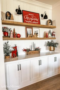 christmas decorations are displayed on the shelves in this room