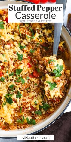 stuffed pepper casserole in a white dish with a spatula on the side