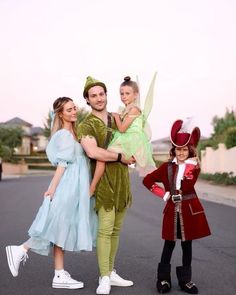 a family dressed up as peter pan and tinkerbell