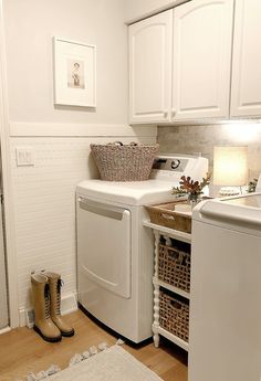 a white washer and dryer in a small room