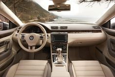 the interior of a car with beige leather seats