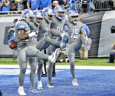 the football team is running onto the field