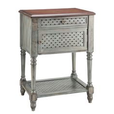 an antique style nightstand table with perfored design on the top and bottom shelf