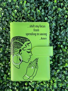 a green passport case with an image of a woman's face and words on it