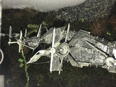 a model of a space ship is shown in the grass