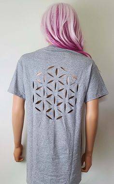 "Show off your awesome style with the Flower of Life Cutout T Shirt! Each Sassy's Edgy Designs cutout shirt is hand-cut all the way through the fabric so you have the option to wear something underneath or let your skin show through. **Please review the sizing chart before purchasing your t shirt to make sure the shirt will fit because I do not accept refunds, thanks! Also please keep in mind that I use Unisex shirts so it may fit looser or longer than a woman's tee but it is true to the sizing Mens Halloween Shirts, Cutout Shirts, Festival Shirt, Sacred Geometry Art, Cutout Top, Hippie Shirt, Yoga Shirt, Geometry Art, Festival Shirts