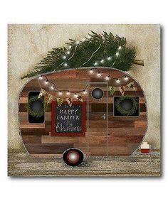 a camper decorated with christmas lights and wreaths