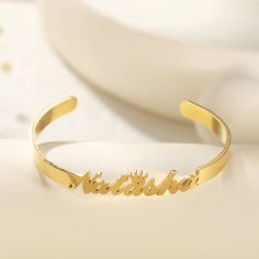 "This name cuff bangle bracelet provide a wonderful way to represent everlasting love or friendship, great to show off the meaning of the word \"forever\". Perfect as a gift for your family, lover, bridesmaid on Wedding, Anniversary, Birthday, Christmas, Mother's Day, Valentine's Day, Graduation. Bracelet width: 2mm; Bracelet Diameter: 62mm. Adjustable to fit mostly wrist.If it is small or large for your wrist,just pull apart or squeeze the bangle to adjust. C U S T O M ∙ N A M E ∙ B A N G L E * Material: High Quality 925 Sterling Silver - Stainless Steel - 18k gold plated * Colors: Gold, Rose Gold, Silver * Each item is made to order, which gives our pieces a unique meaning that is specific and special to you ♥ H O W ∙ T O ∙ O R D E R * Simply use the 'PERSONALIZATION BOX' to let us know Graduation Bracelet, Engraved Bangle, Bracelet Couple, Bracelet Christmas, Bracelets Design, Personalized Bracelet, Sterling Silver Bangle, Cuff Bangle Bracelet, Pull Apart