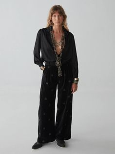 This feels like you... This chic, wide-leg embroidered pants by Maison Hotel offer a mix of bohemian sophistication with a touch of edge. Features: Women's wide leg pants Relaxed fit High waist All-over embroidery Materials: 100% Cotton Luxury Embellished Pants For Fall, Chic Luxury Festive Pants, Luxury Chic Festive Pants, Luxury Festive Full-length Pants, Luxury Embroidered Bottoms For Evening, Luxury Festive Trousers, Luxury Black Loungewear Bottoms, Luxury Women's Pants With Embroidered Hem, Luxury Embroidered Trousers