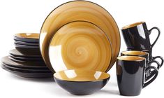 black and gold dinnerware set on white background