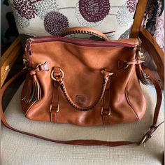 Dooney And Bourke Large Florentine Leather Satchel - Good Condition - Height: About 13” -Width : About 11” - Super Cute And Classy! - Spacious - Has Adjustable And Attachable/Detachable Crossbody Strap - Inside Of Bag Is Just A Little Dirty, Not Bad Though Not Bad, Dooney And Bourke, Dooney & Bourke Bags, Dooney & Bourke, Leather Satchel, Crossbody Strap, Dooney Bourke, Satchel, Bag Lady