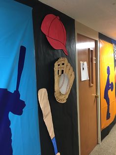 the hallway is decorated with sports themed wallpapers and baseball bats, hats, and mitts