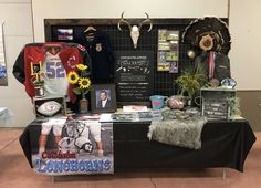 a table that has various items on it and is displaying an award for the longhorns