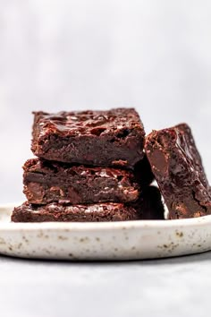 chocolate brownies stacked on top of each other