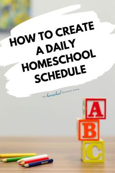 the words how to create a daily homeschool schedule with blocks and crayons